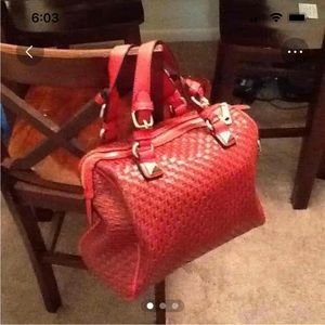 Red woven leather handbag. No name brand.